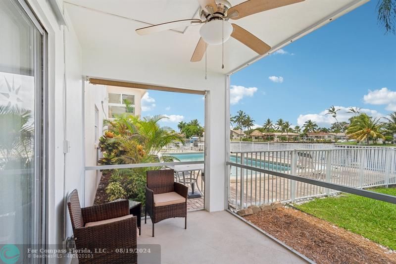 a view of a balcony with furniture