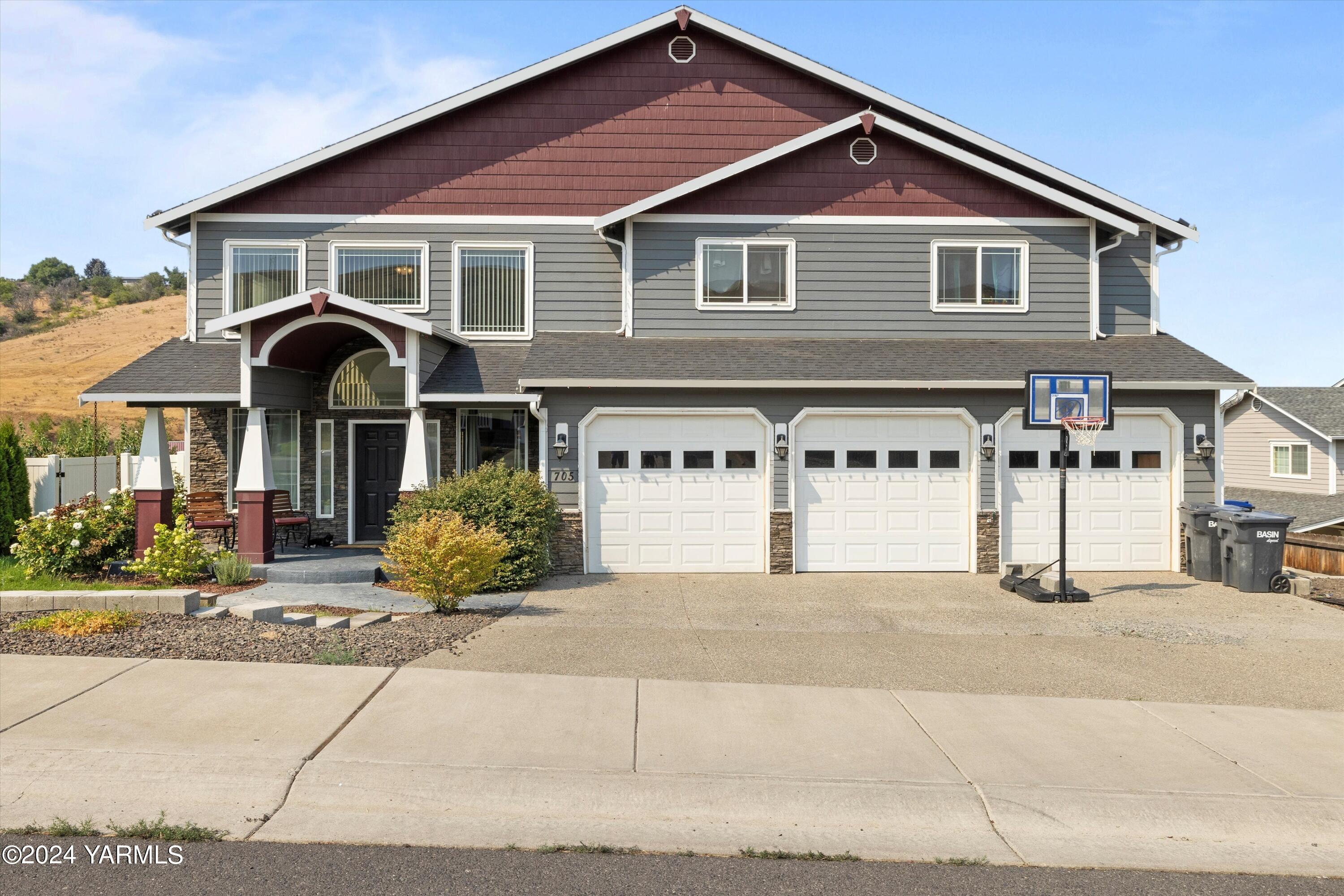 a front view of a house with yard