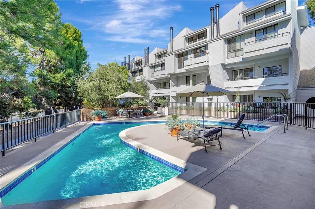 a view of a swimming pool with a patio