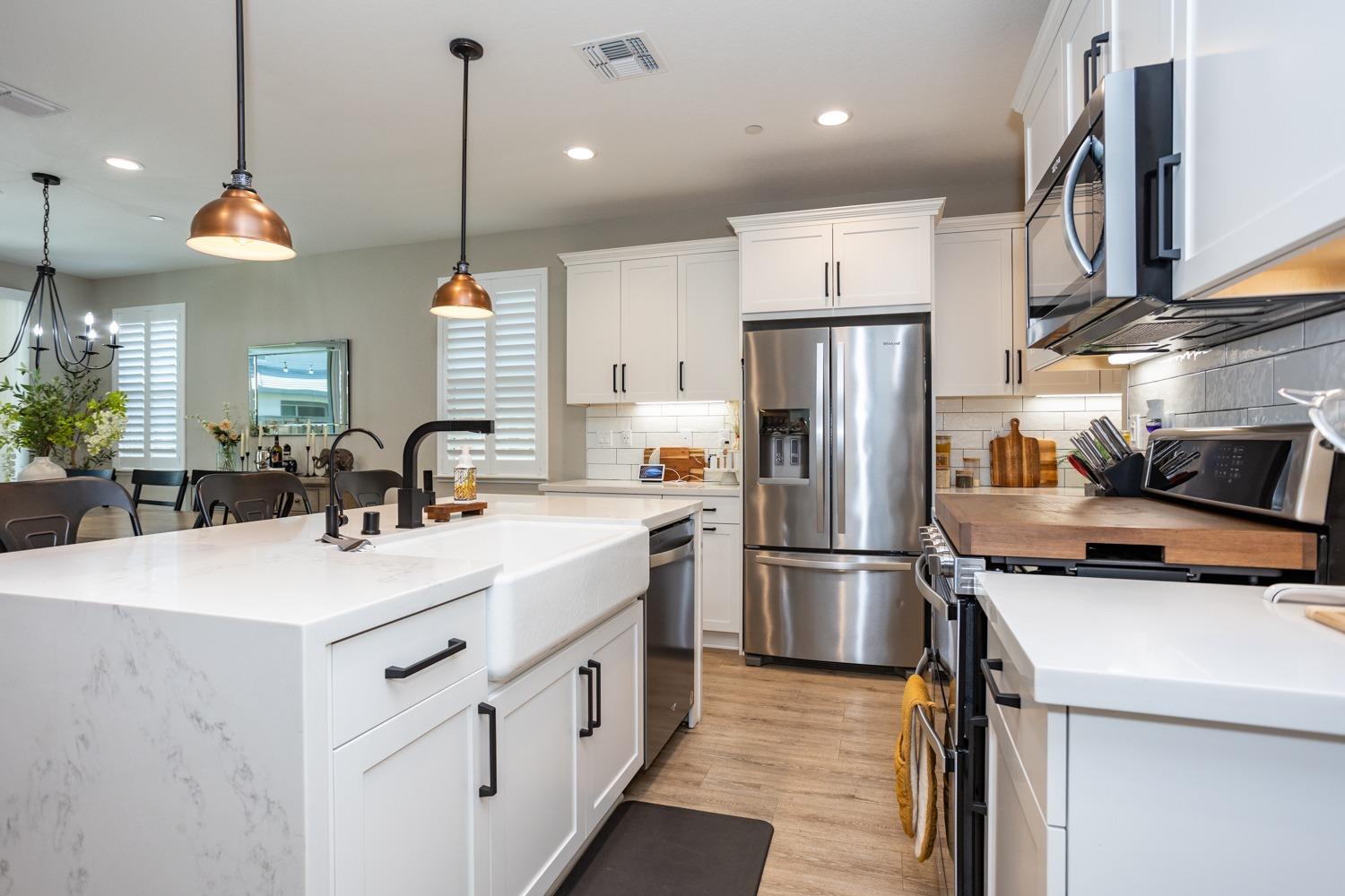 Upgrades:  Waterfall Quartz Island, Farm Sink, Copper Pendants.