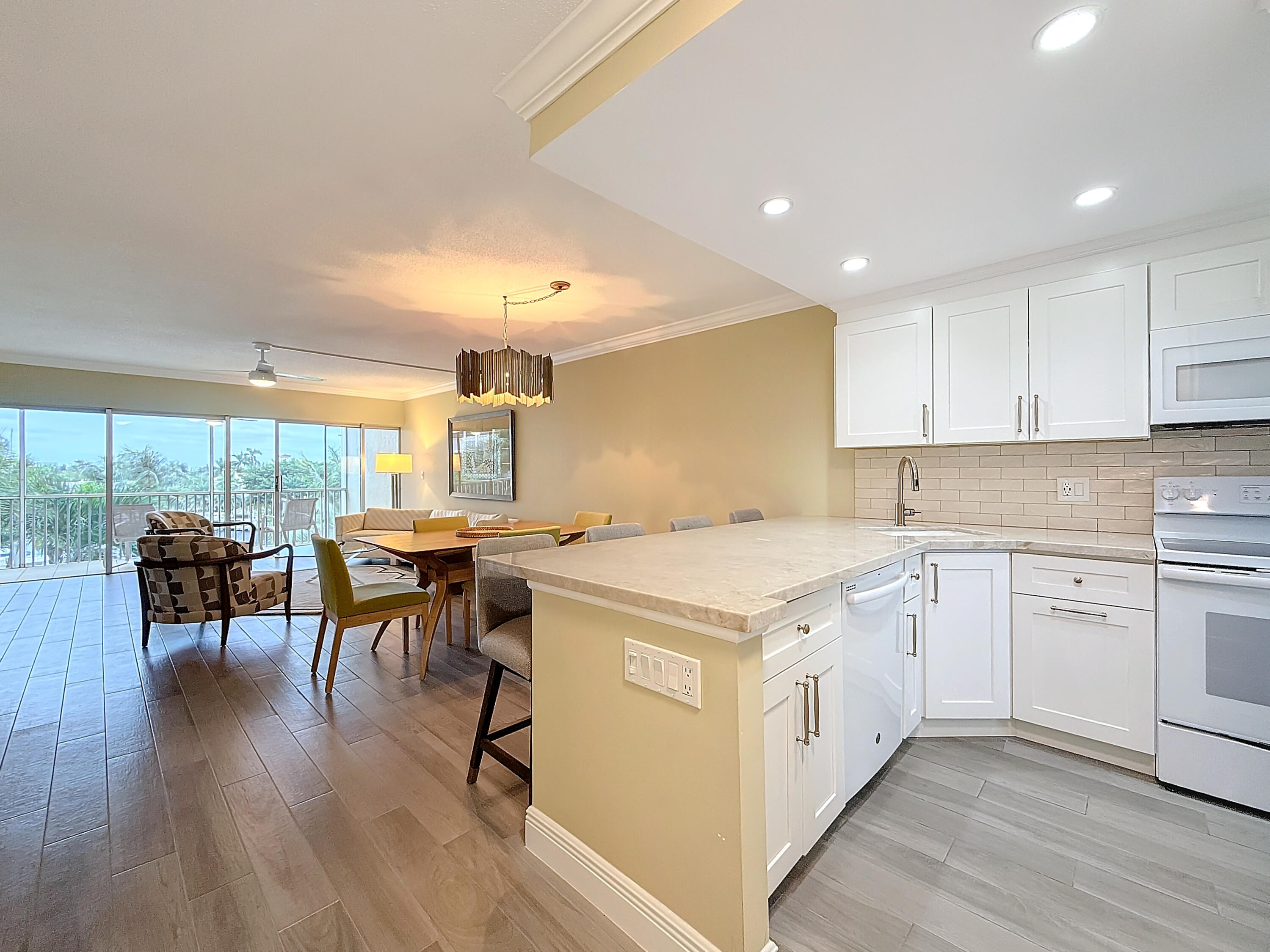 a kitchen with a table chairs stove and cabinets