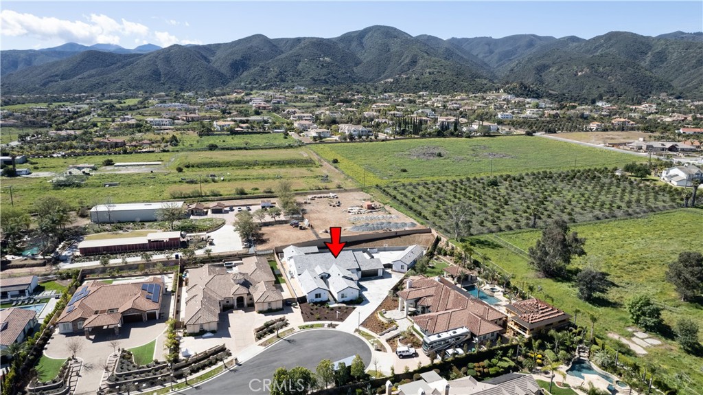 an aerial view of a house with a garden