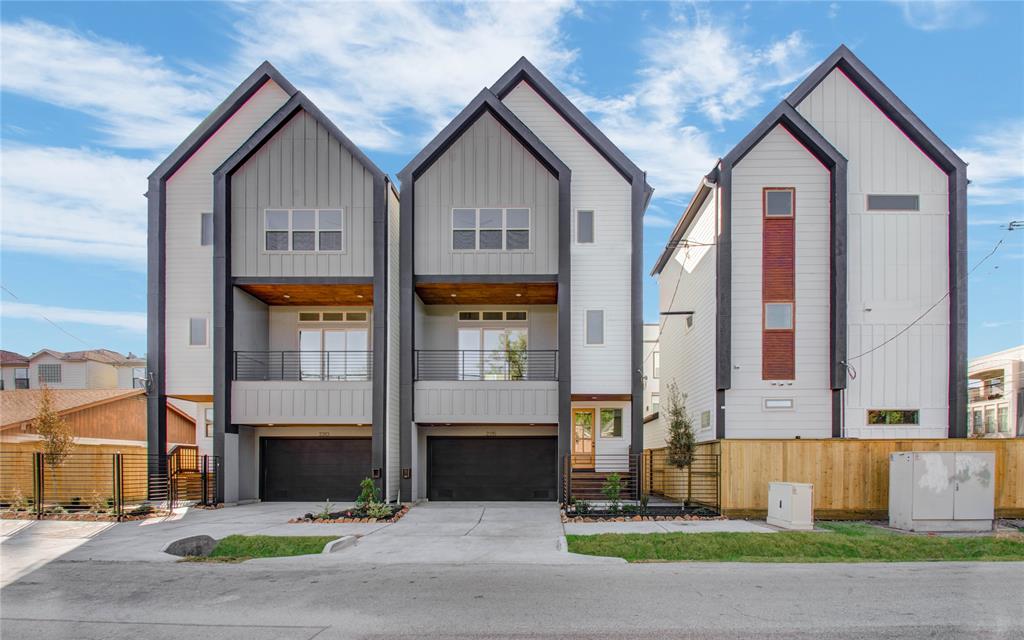 a view of multiple houses with a yard