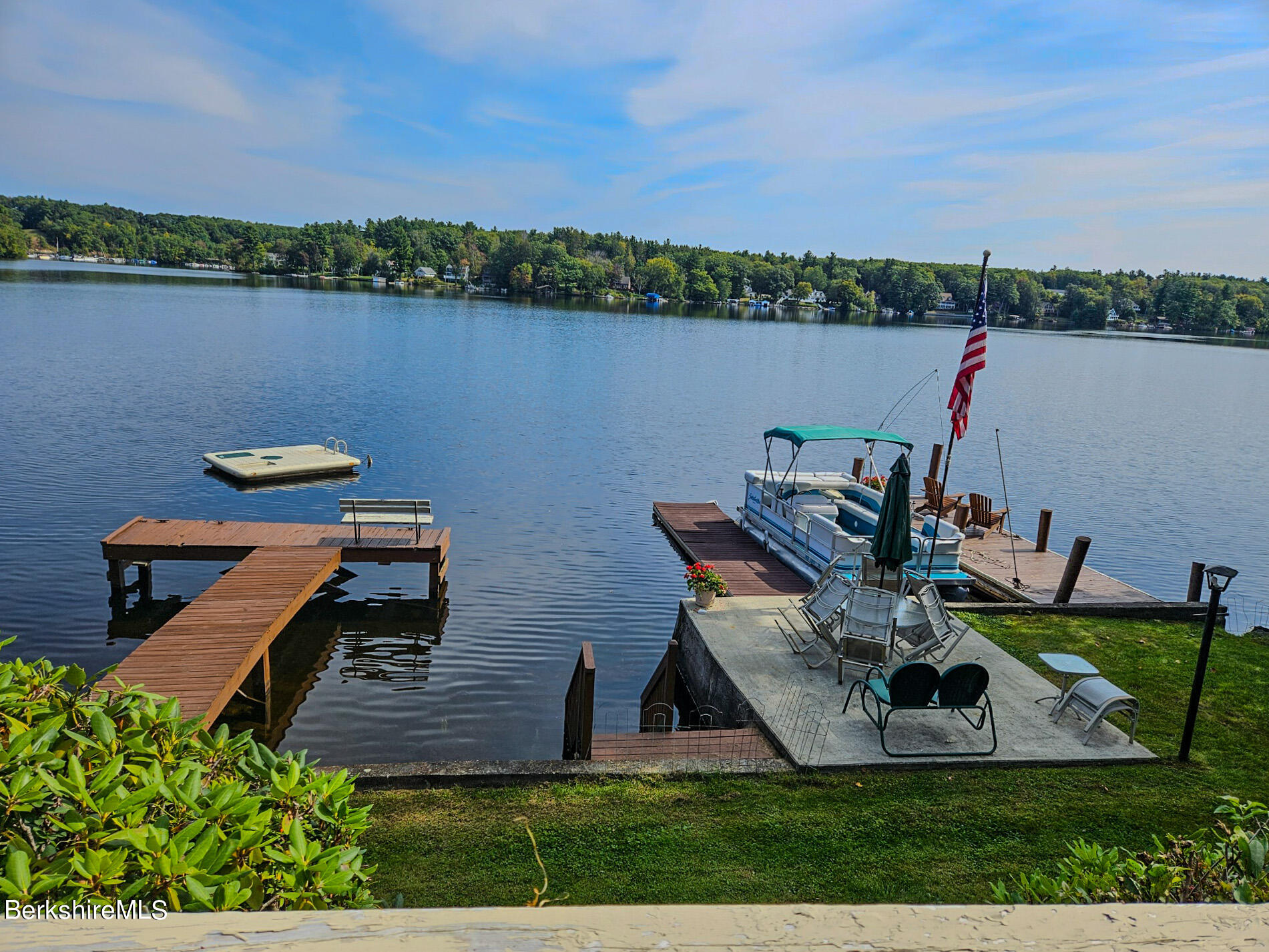 a view of a lake with sitting area