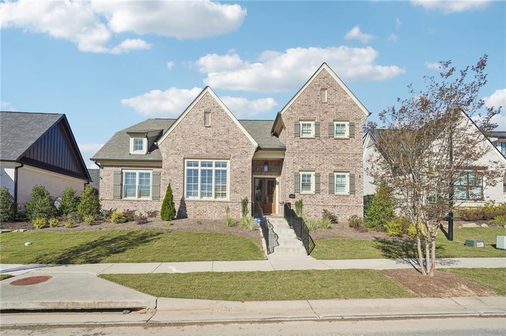 a front view of a house with a yard