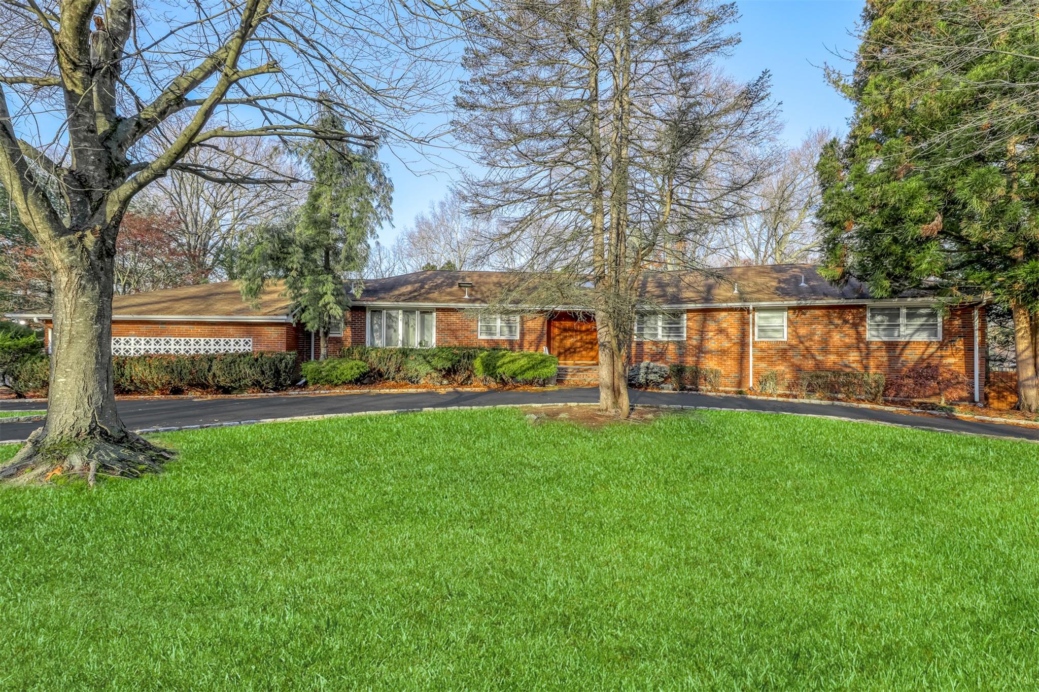 Ranch-style home with a front yard