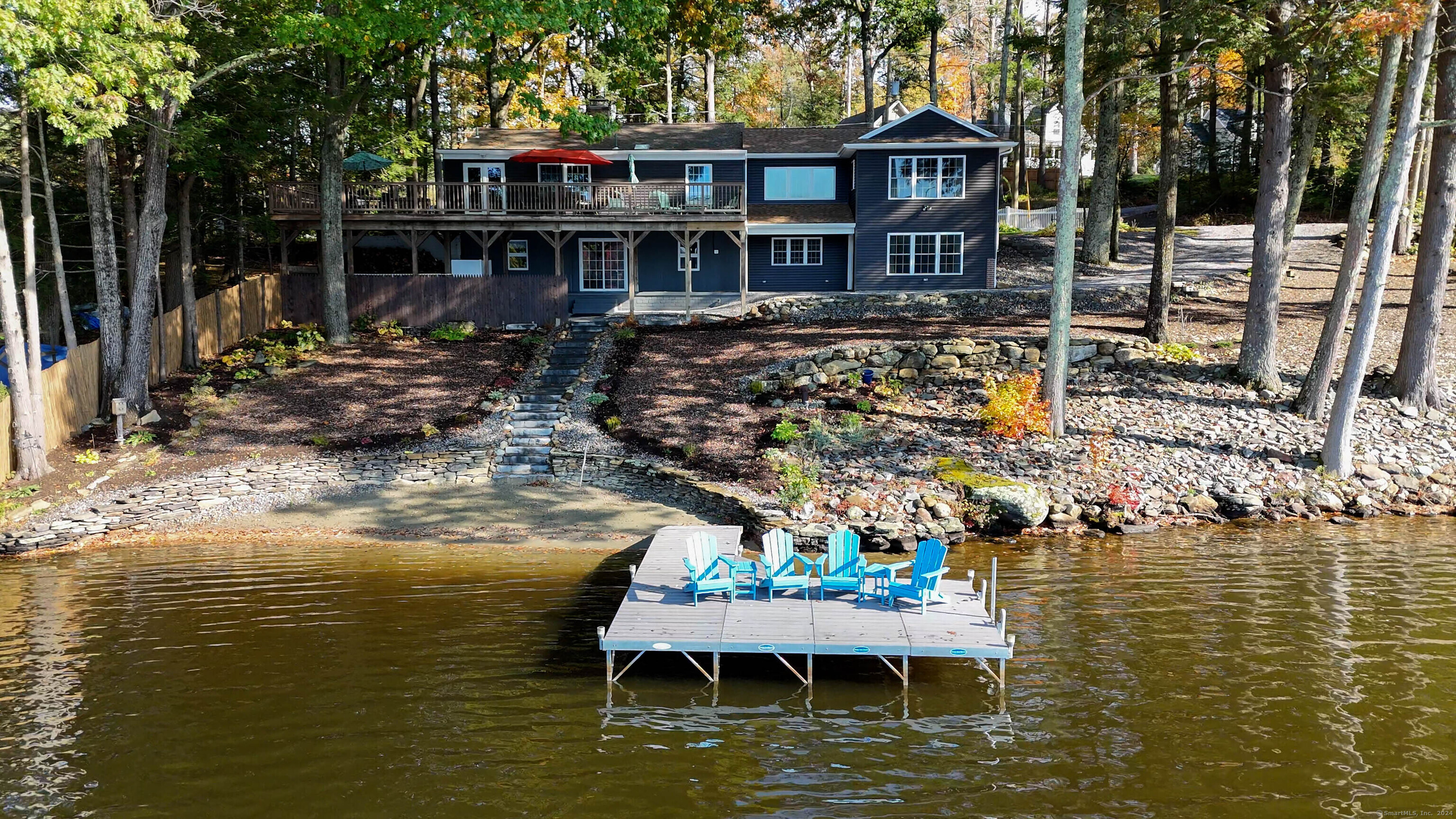 a view of a house with swimming pool and sitting area