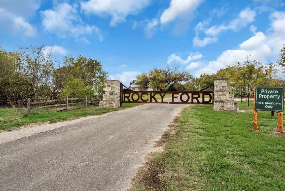 a view of a park with welcome board