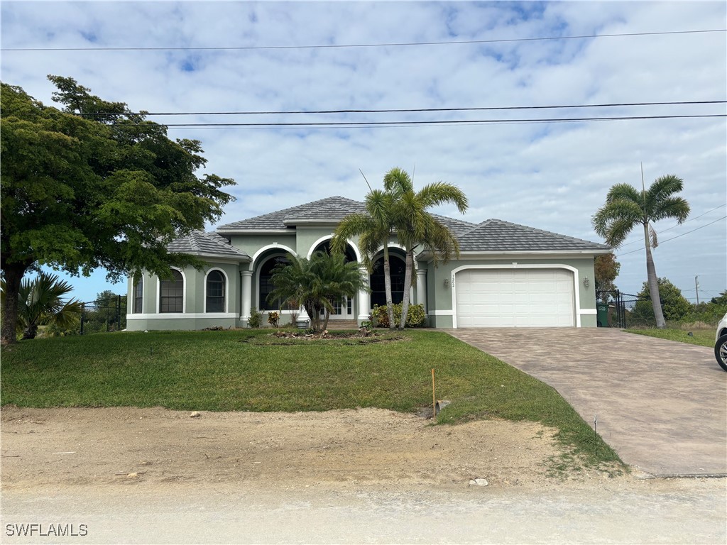 a front view of a house with garden