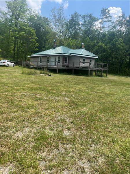 a view of a house with a big yard