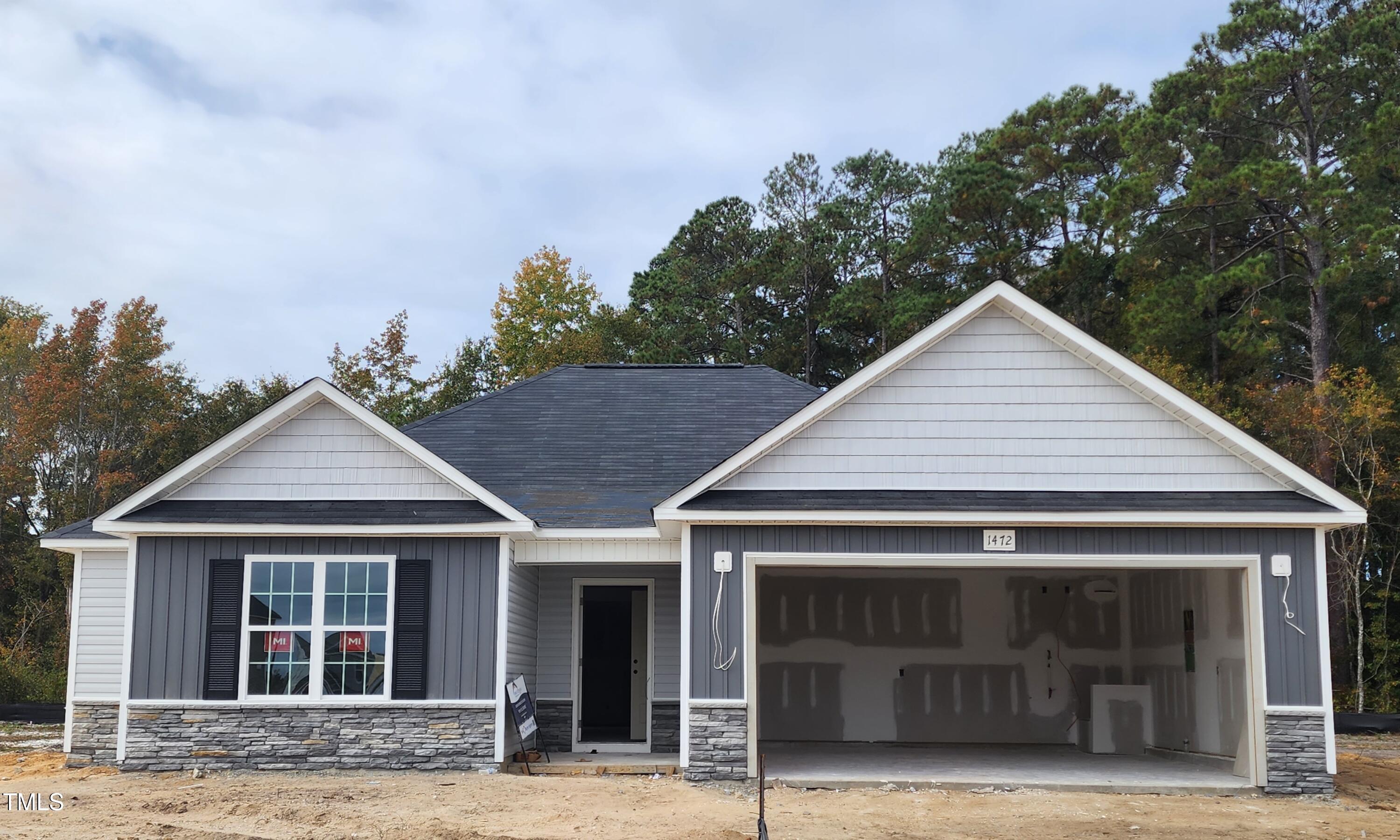 front view of a house and a yard