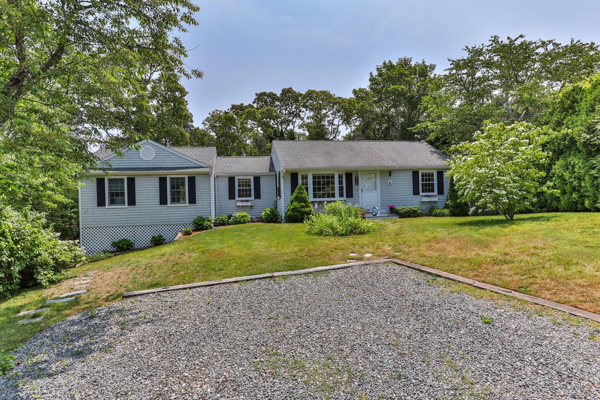 a view of a house with a yard