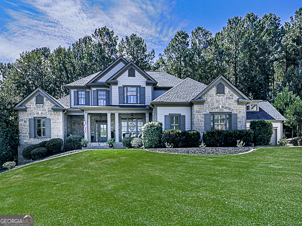 a front view of a house with a yard