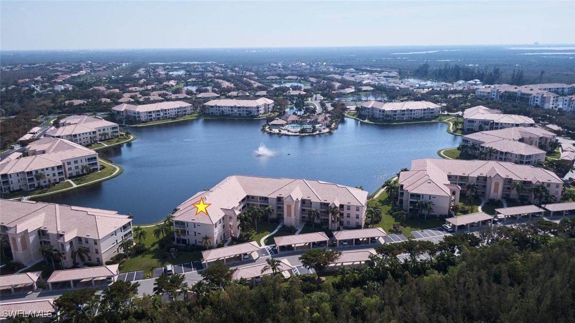 an aerial view of a house with a lake view