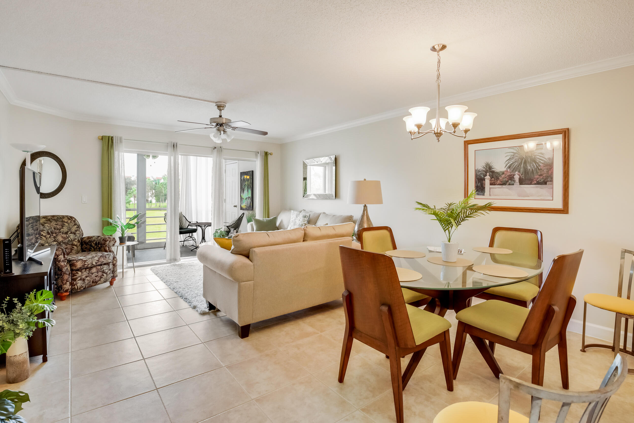 a living room with furniture a chandelier and a chandelier