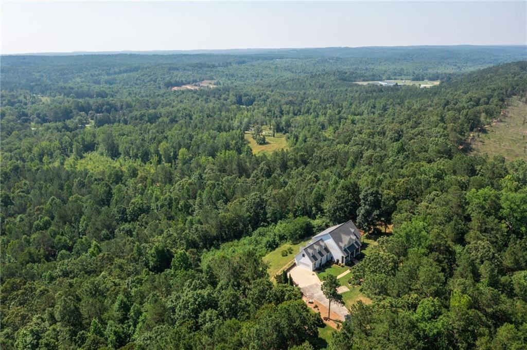 an aerial view of residential house with outdoor space