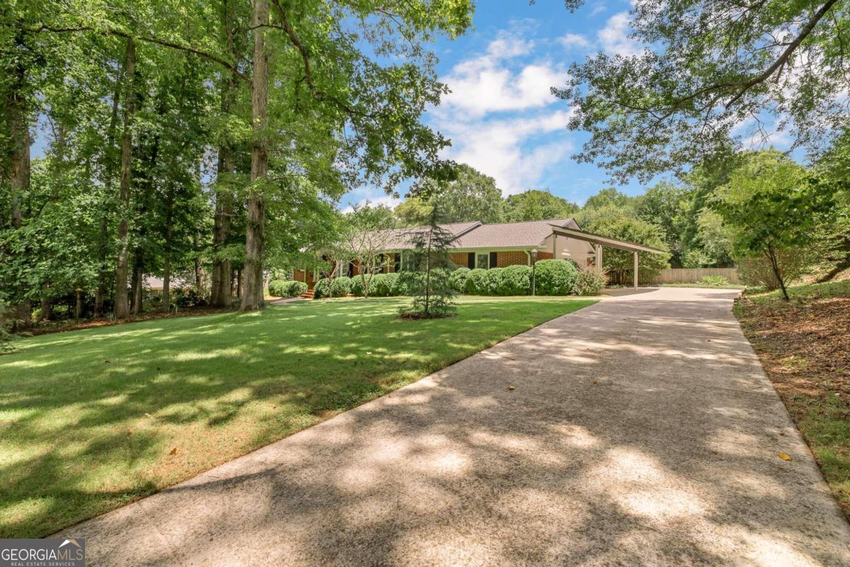 a view of a house with a big yard