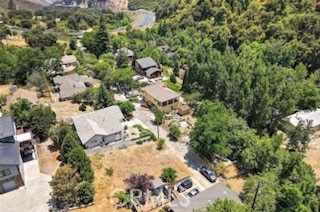 an aerial view of residential house with outdoor space