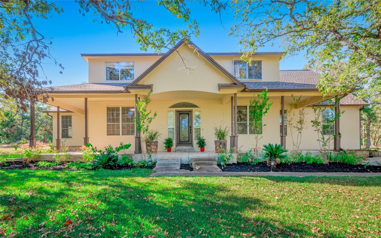 a front view of a house with a yard