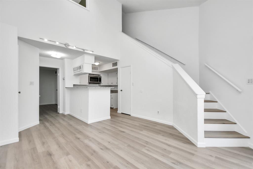 a view of a kitchen cabinets and wooden floor