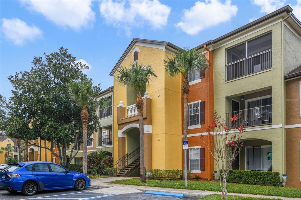 a front view of a residential apartment building with a yard