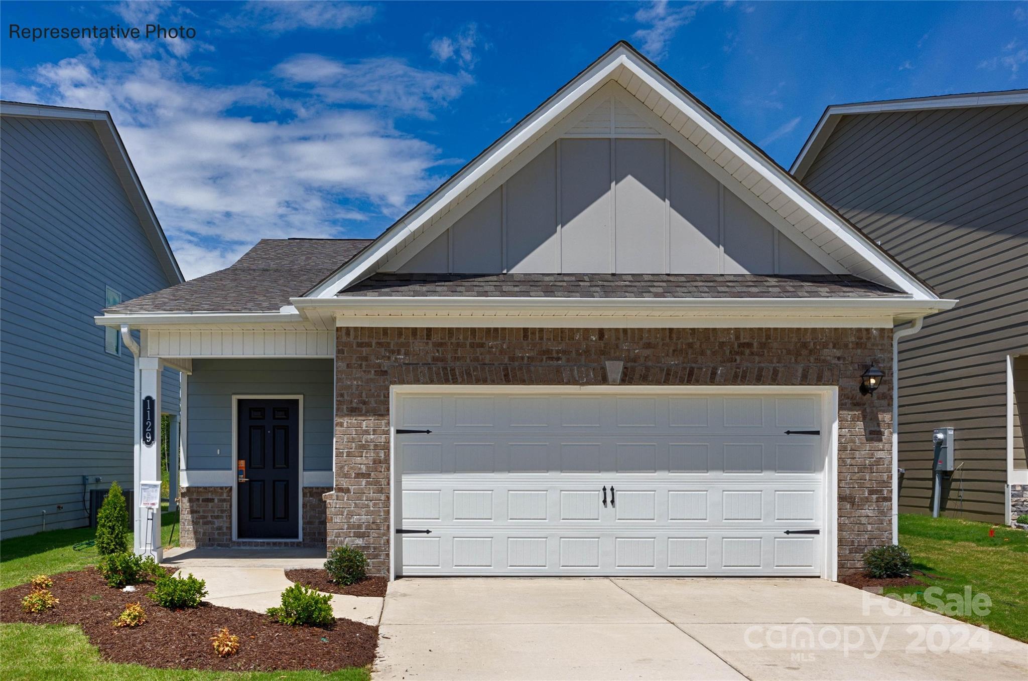 a front view of a house with a garage