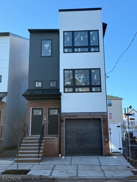 a front view of a house with stairs