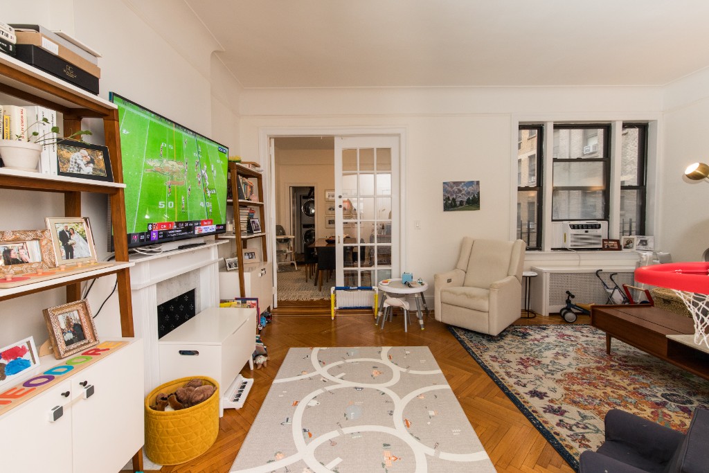 a living room with furniture and a fireplace