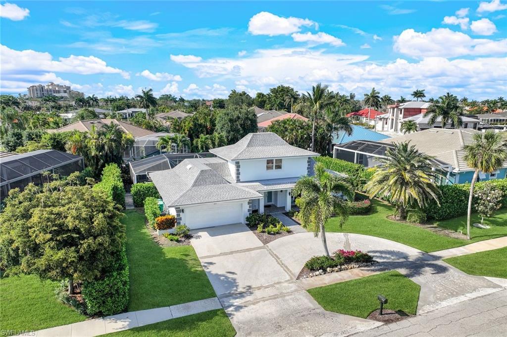 a aerial view of a house with a yard