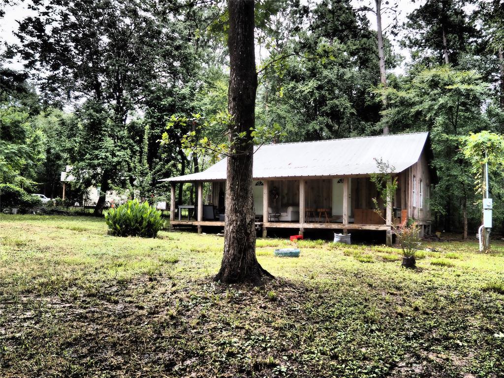 a view of a house with swimming pool and sitting area