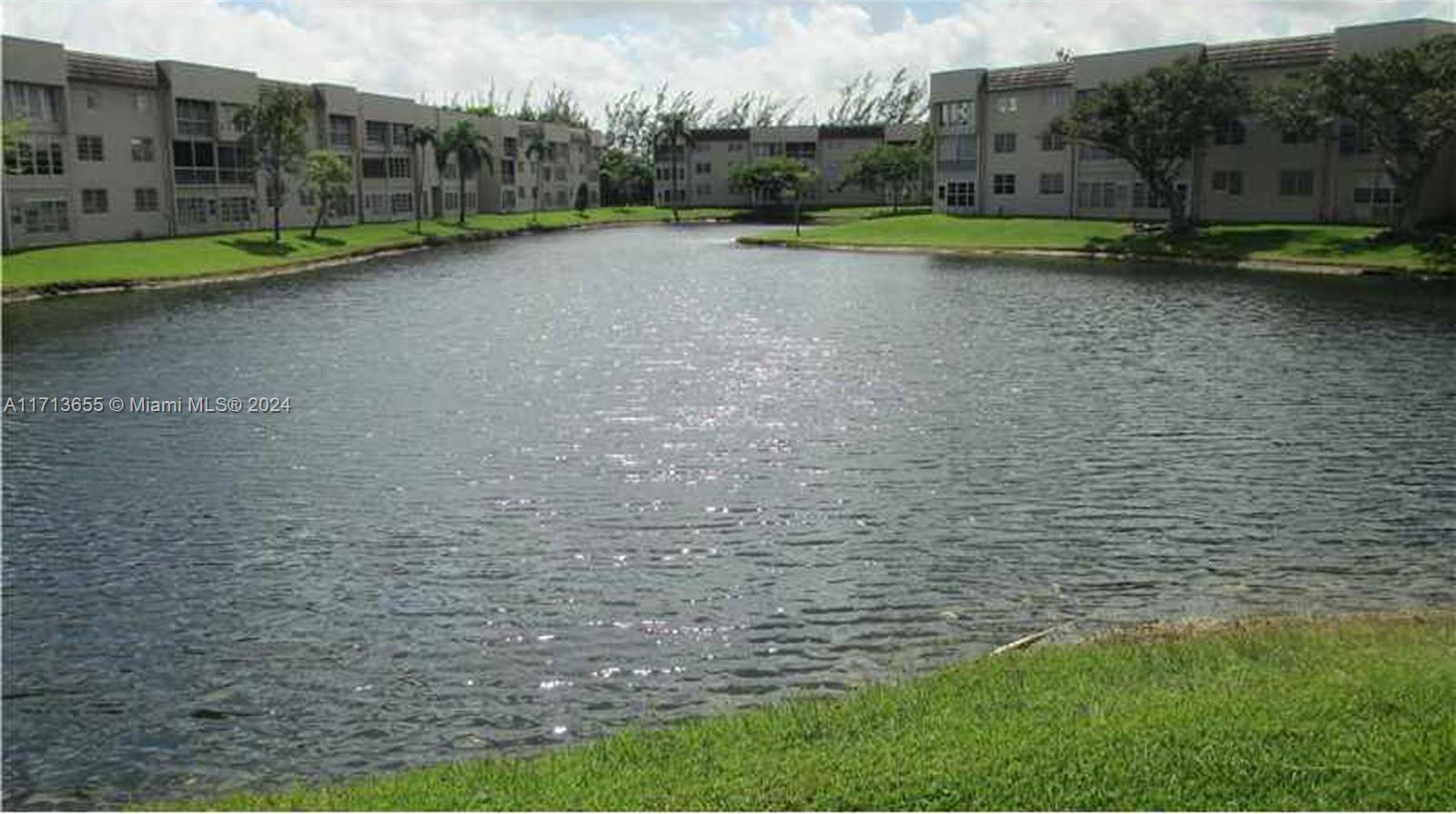 a view of a golf course with a lake