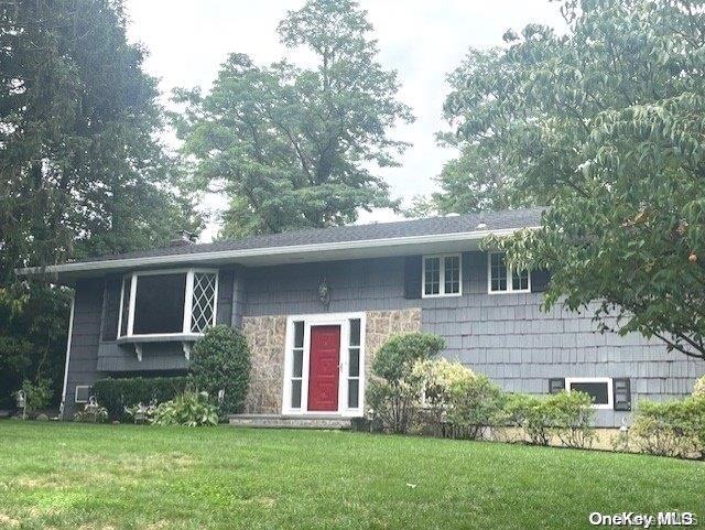 front view of a house with a yard