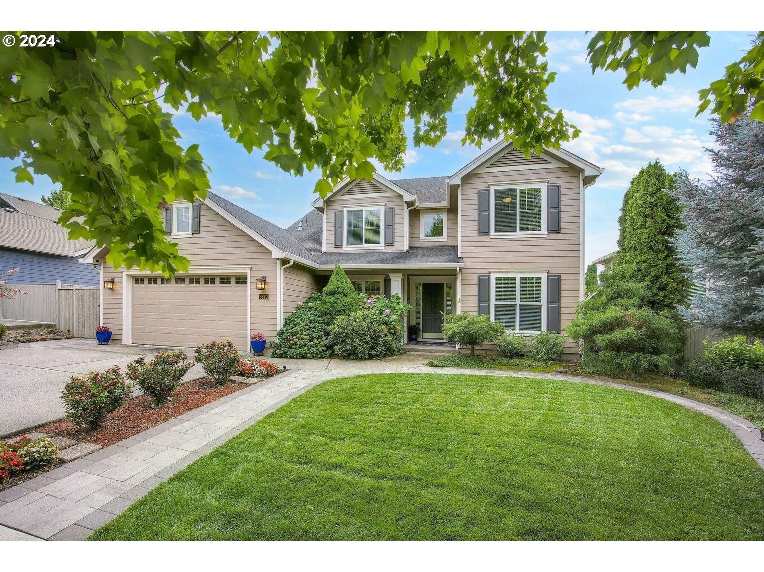 a front view of a house with a yard