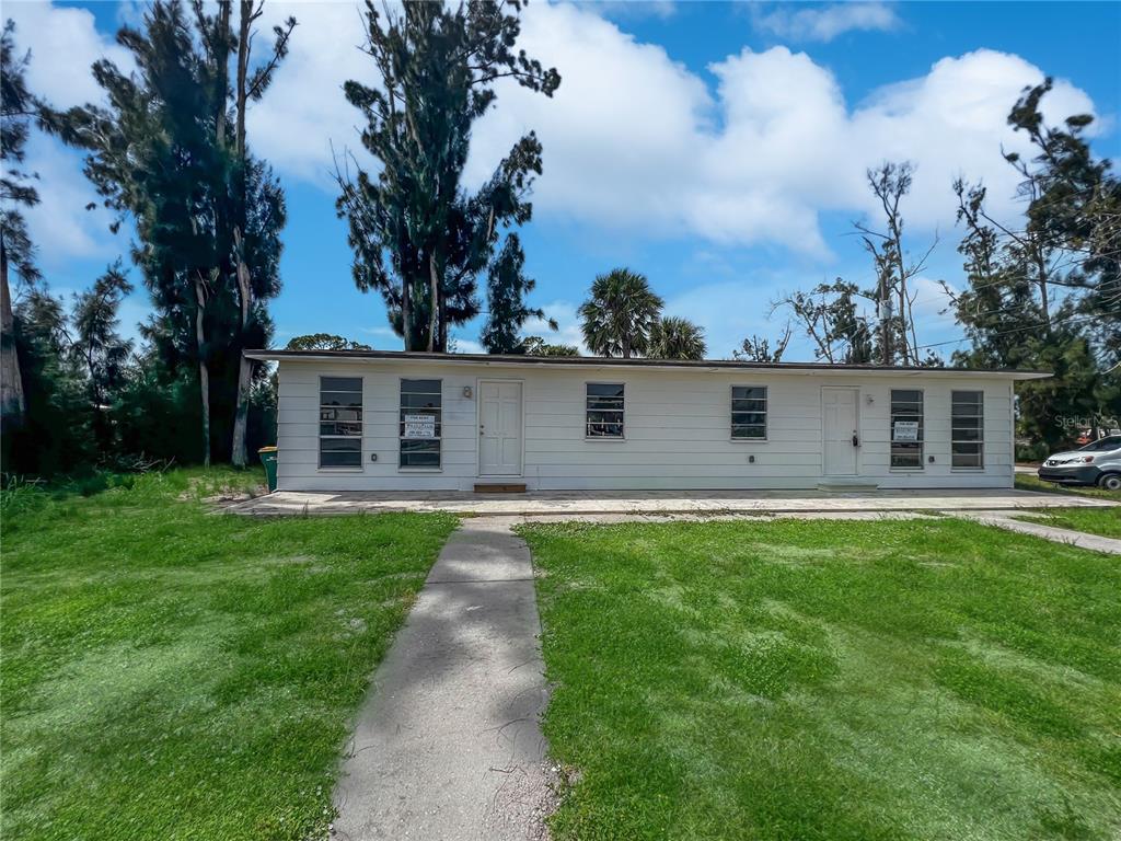 a view of a back yard of the house