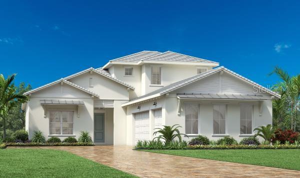 a front view of a house with a yard and potted plants