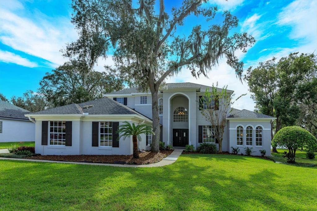 a front view of a house with a yard