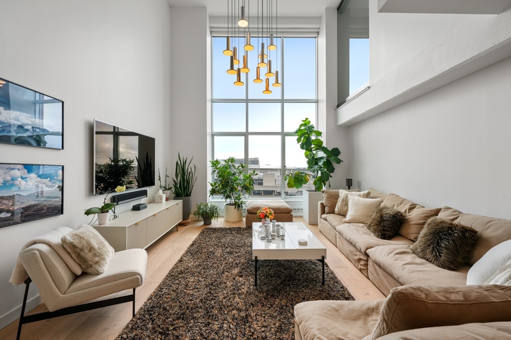 a living room with furniture fireplace and a flat screen tv