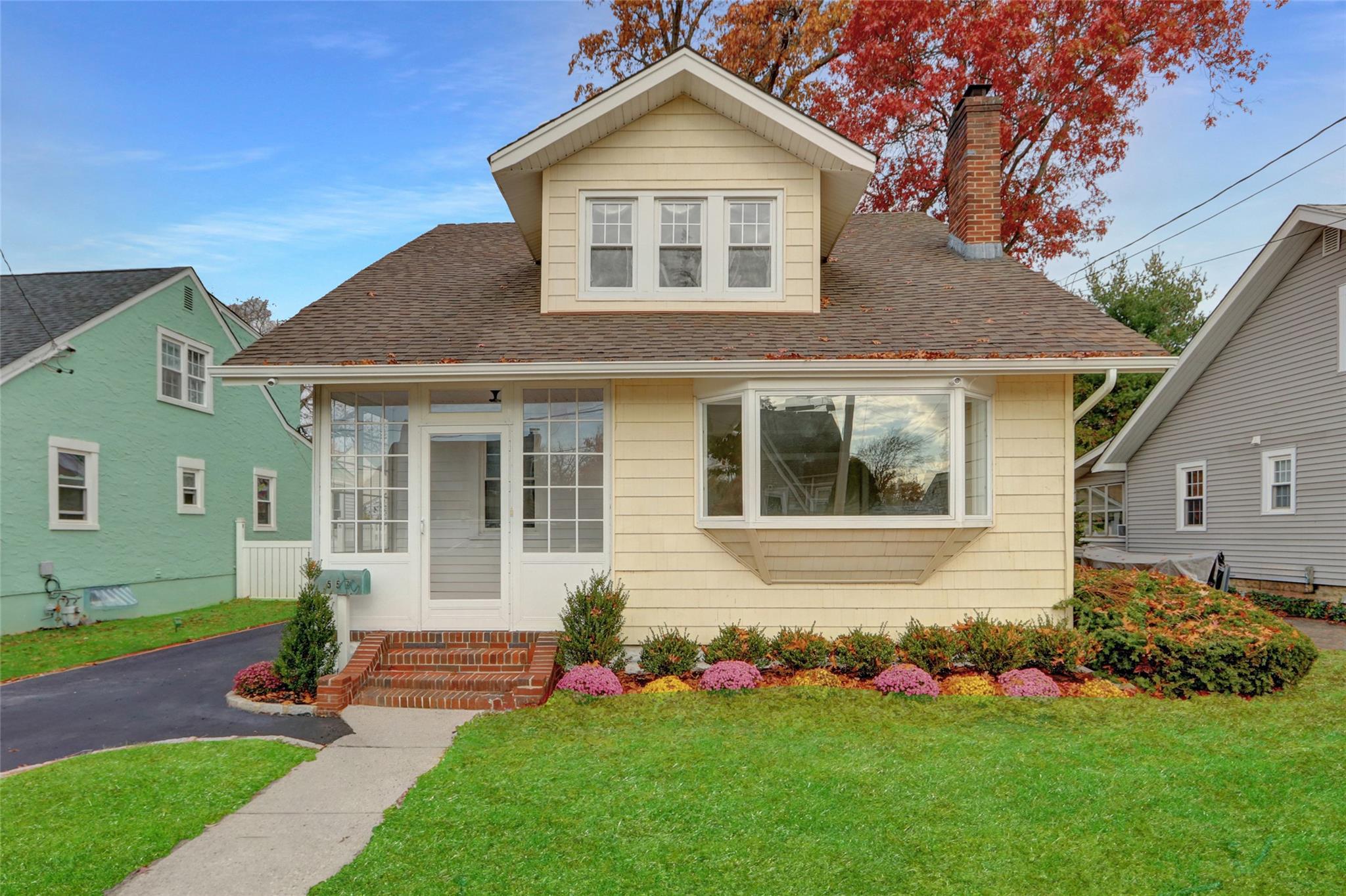 Bungalow-style house featuring a front lawn