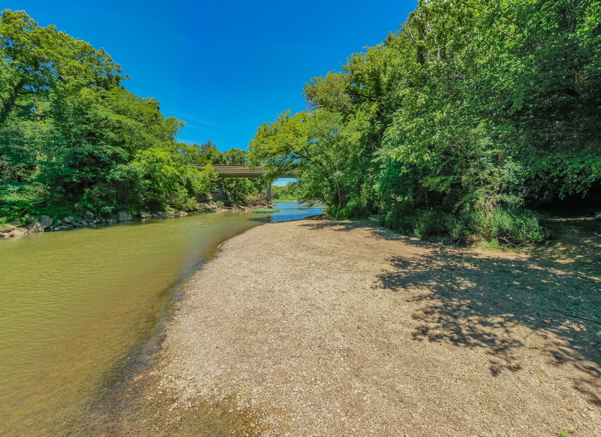 a view of a lake with a yard