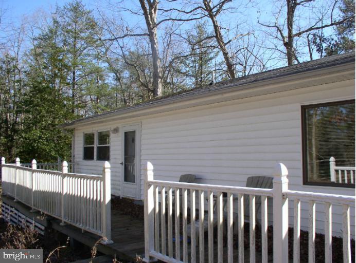 a view of a house with a small yard