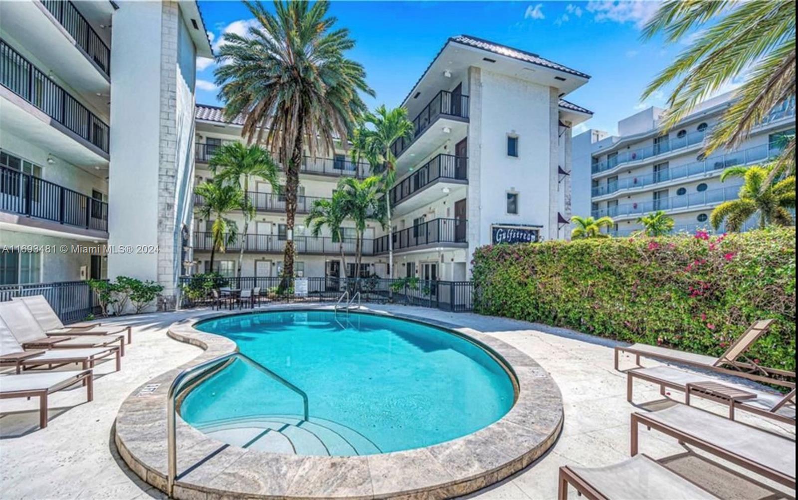 a view of a swimming pool with a patio