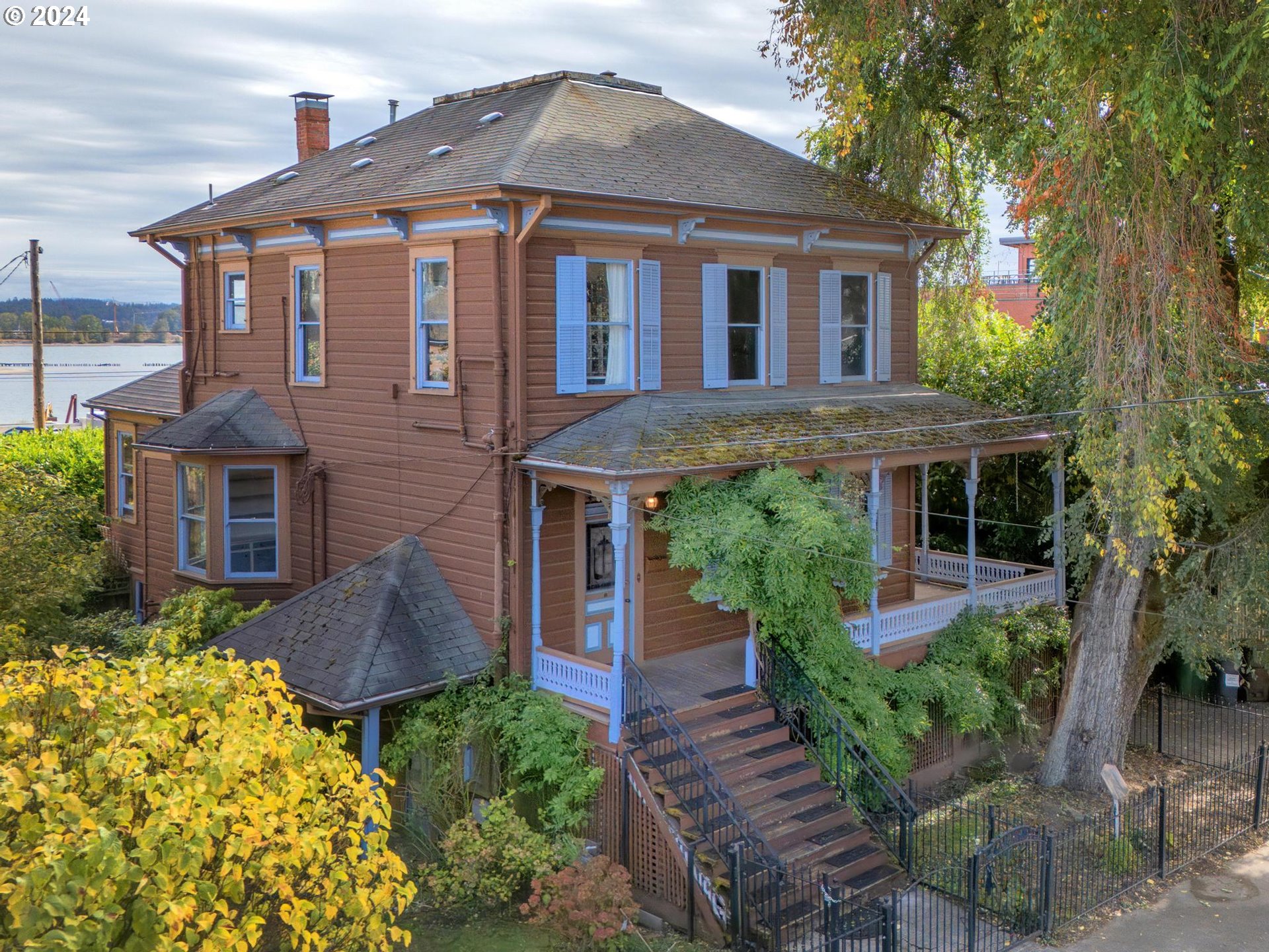 a front view of a house with garden