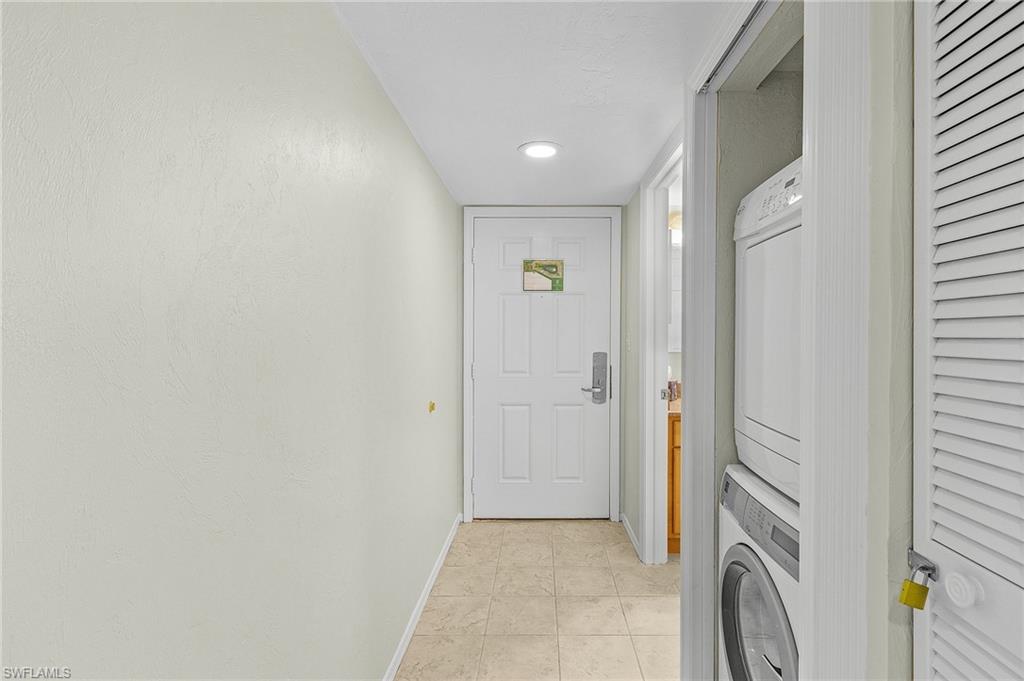 a view of a hallway with washer and dryer