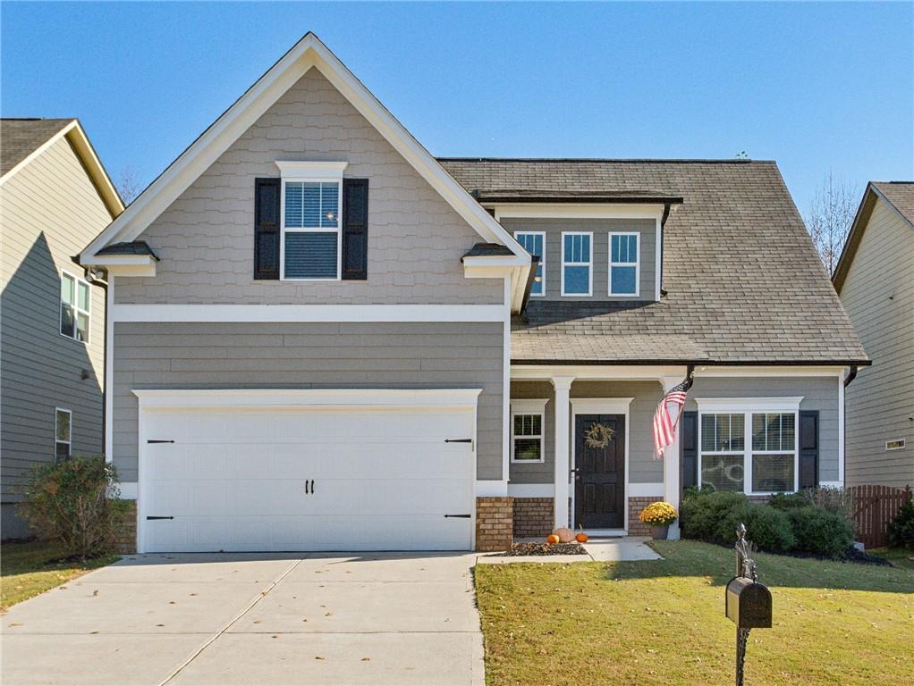 front view of a house with a yard