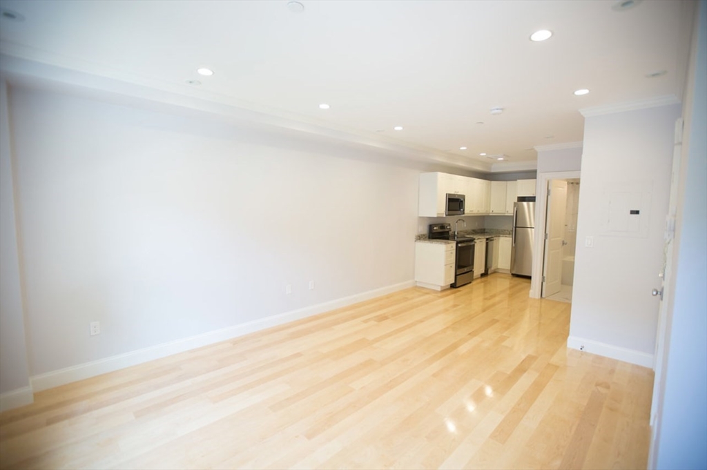 a view of a kitchen with a sink and microwave