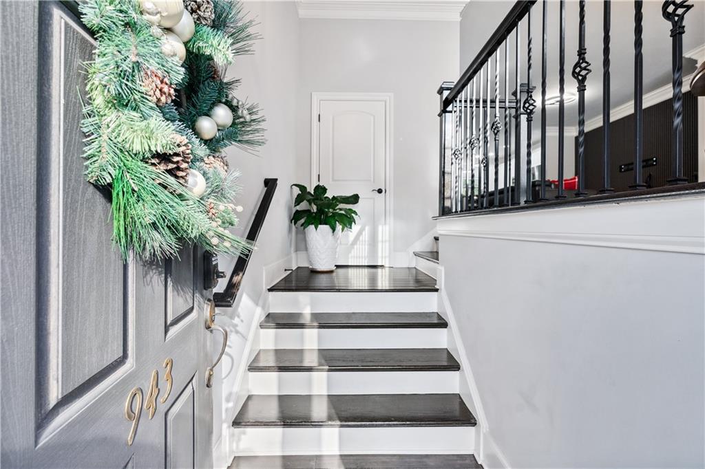 a view of staircase with wooden floor and a potted plant