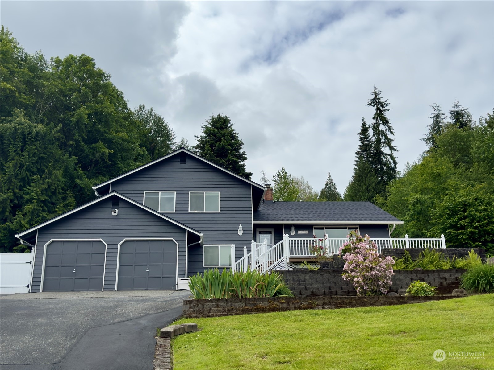 a front view of a house with garden