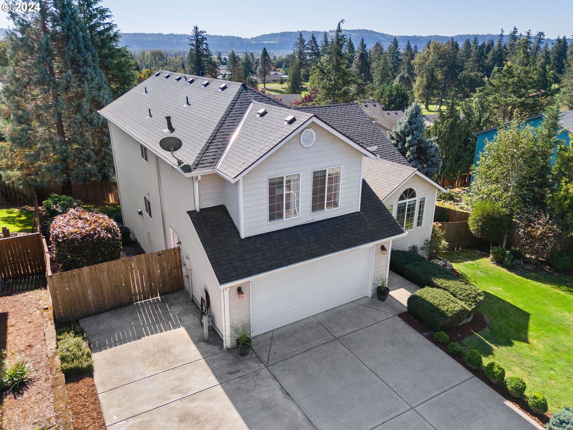 a aerial view of a house with a yard