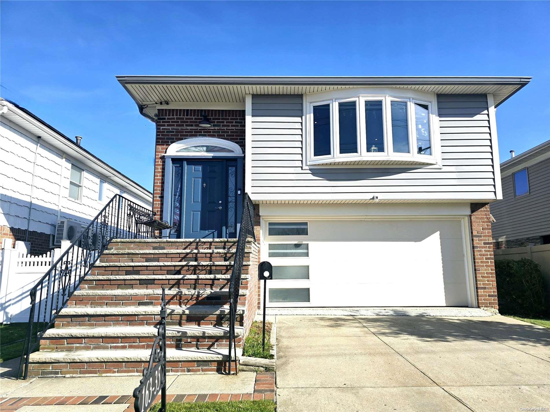 a front view of a house with a garage