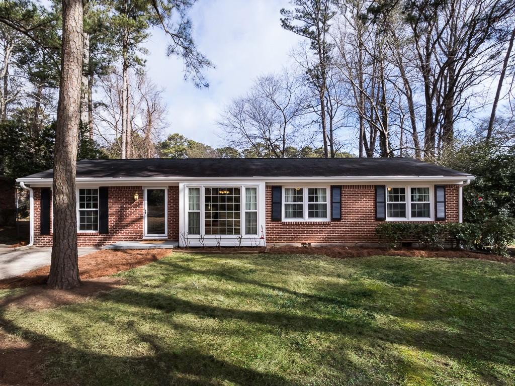 front view of a house with a yard